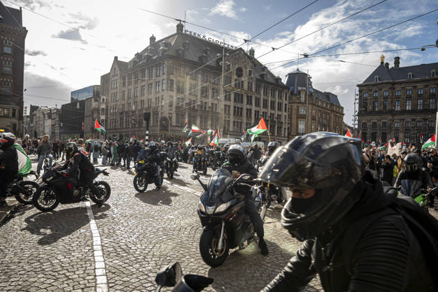 October 11, 2026, Amsterdam, North Holland, The Netherlands - Holland: 11 October 2026, Amsterdam, the Netherlands: The group Bikers for Palestine arrives to Dam Square. Protesters gathered at Dam Square for speeches and anti-war music before marching through AmsterdamÃ¢â‚¬â ¢s city centre in a demonstration dubbed Ã¢â‚¬oeThree Years of GenocideÃ¢â‚¬Â. The event marked three years since the start of the IsraelÃ¢â‚¬Hamas war. Demonstrators carried Palestinian flags and banners, demanding the Dutch government act against what they describe as a genocide in Gaza. Amsterdam The Netherlands - Holland - ZUMAp202 20261011_zip_p202_012 Copyright: xJamesxPetermeierx