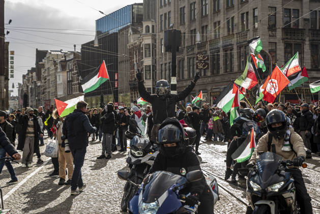 October 11, 2026, Amsterdam, North Holland, The Netherlands - Holland: 11 October 2026, Amsterdam, the Netherlands: The group Bikers for Palestine arrives to Dam Square. Protesters gathered at Dam Square for speeches and anti-war music before marching through AmsterdamÃ¢â‚¬â ¢s city centre in a demonstration dubbed Ã¢â‚¬oeThree Years of GenocideÃ¢â‚¬Â. The event marked three years since the start of the IsraelÃ¢â‚¬Hamas war. Demonstrators carried Palestinian flags and banners, demanding the Dutch government act against what they describe as a genocide in Gaza. Amsterdam The Netherlands - Holland - ZUMAp202 20261011_zip_p202_013 Copyright: xJamesxPetermeierx