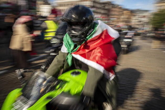 October 11, 2026, Amsterdam, North Holland, The Netherlands - Holland: 11 October 2026, Amsterdam, the Netherlands: The group Bikers for Palestine departs from Dam Square. Protesters gathered at Dam Square for speeches and anti-war music before marching through AmsterdamÃ¢â‚¬â ¢s city centre in a demonstration dubbed Ã¢â‚¬oeThree Years of GenocideÃ¢â‚¬Â. The event marked three years since the start of the IsraelÃ¢â‚¬Hamas war. Demonstrators carried Palestinian flags and banners, demanding the Dutch government act against what they describe as a genocide in Gaza. Amsterdam The Netherlands - Holland - ZUMAp202 20261011_zip_p202_022 Copyright: xJamesxPetermeierx