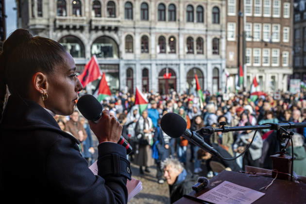 October 11, 2026, Amsterdam, North Holland, The Netherlands - Holland: 11 October 2026, Amsterdam, the Netherlands: A speaker addresses hundreds of pro-Palestinian protesters gathered at Dam Square. Following more speeches and anti-war music, they marched through AmsterdamÃ¢â‚¬â ¢s city centre in a demonstration dubbed Ã¢â‚¬oeThree Years of GenocideÃ¢â‚¬Â. The event marked three years since the start of the IsraelÃ¢â‚¬Hamas war. Demonstrators carried Palestinian flags and banners, demanding the Dutch government act against what they describe as a genocide in Gaza. Amsterdam The Netherlands - Holland - ZUMAp202 20261011_zip_p202_027 Copyright: xJamesxPetermeierx