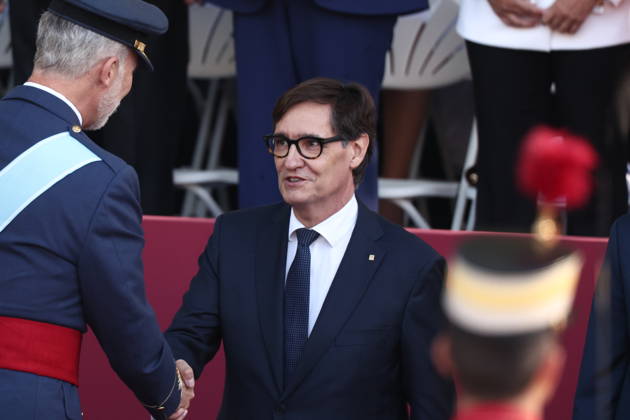 October 12 Parade for Hispanic Heritage Day: King Felipe VI greets the President of the Generalitat de Catalunya, Salvador Illa, during the solemn ceremony honoring the national flag and the military parade on October 12, Hispanic Heritage Day, in the Plaza de Cánovas del Castillo, on October 12, 2026, in Madrid, Spain. The ceremonies begin with the raising of the flag and are followed by a tribute to those who gave their lives for the country. Subsequently, the military air and ground parades begin. Approximately 4,400 members of the Armed Forces, the security forces, and various civilian public institutions are participating this year in the parade presided over by the King and Queen. The aerial parade featured 50 fighter, training, and  Copyright: xEduardoxParrax 7840585