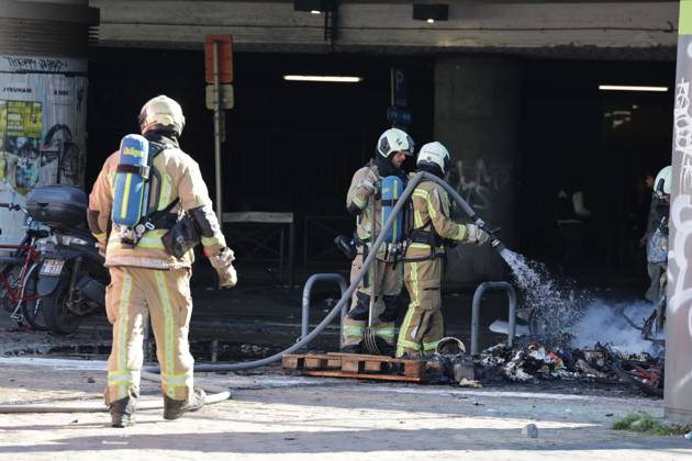 Firefighters pictured after a riot outside the Gare du Midi-Zuid Station, in Brussels on Monday 12 October 2026, as a strike in the public services against the Federal Government s budgetary measures is organised by the trade unions.  NICOLASxMAETERLINCK 189545339