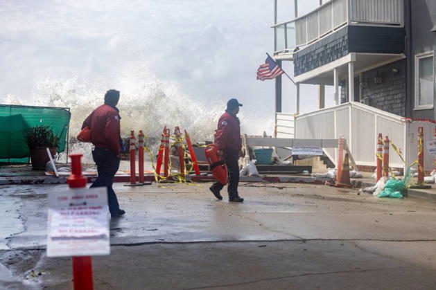 October 11, 2026, Long Beach, California, USA: Waves crash into the boardwalk along the Belmont Shore peninsula while Long Beach City Lifeguards watch as remnants of Tropical Storm Rachel make their way through Southern California. Long Beach USA - ZUMAc316 20261011_znp_c316_004 Copyright: xEthanxCohenx