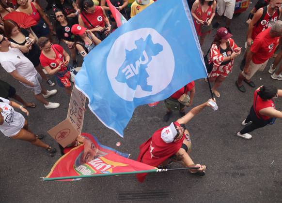 October 12, 2026, Rio De Janeiro, Rio De Janeiro, Brazil: Thousands of supporters gather in Copacabana, Rio de Janeiro, Brazil, on October 12, 2026, for a pro-democracy demonstration organized by the CENA Nacional movement, the National Union of Students (UNE) and Universibloco. Held on Brazilâ€⠢s Our Lady of Aparecida national holiday, the rally calls for the defense of constitutional rights and public policies supporting healthcare, education and social assistance. Carnival street bands, known as blocos, and percussion groups brought music and a festive atmosphere to the waterfront mobilization, blending political activism with Rioâ€⠢s popular street culture. The demonstration takes place ahead of Brazilâ€⠢s October 25 pres - ZUMAk251 20261012_znp_k251_003 Copyright: xBobxKarpx