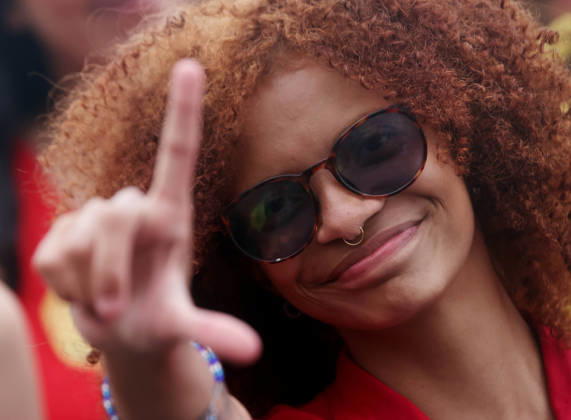 October 12, 2026, Rio De Janeiro, Rio De Janeiro, Brazil: A supporter flashes an L for Lula as thousands of supporters gather in Copacabana, Rio de Janeiro, Brazil, on October 12, 2026, for a pro-democracy demonstration organized by the CENA Nacional movement, the National Union of Students (UNE) and Universibloco. Held on Brazilâ€⠢s Our Lady of Aparecida national holiday, the rally calls for the defense of constitutional rights and public policies supporting healthcare, education and social assistance. Carnival street bands, known as blocos, and percussion groups brought music and a festive atmosphere to the waterfront mobilization, blending political activism with Rioâ€⠢s popular street culture. The demonstration takes place ahe - ZUMAk251 20261012_znp_k251_008 Copyright: xBobxKarpx