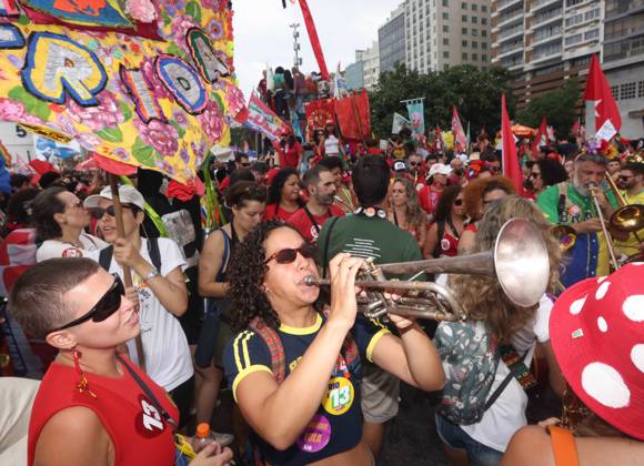 October 12, 2026, Rio De Janeiro, Rio De Janeiro, Brazil: Thousands of supporters gather in Copacabana, Rio de Janeiro, Brazil, on October 12, 2026, for a pro-democracy demonstration organized by the CENA Nacional movement, the National Union of Students (UNE) and Universibloco. Held on BrazilÃ¢â‚¬â ¢s Our Lady of Aparecida national holiday, the rally calls for the defense of constitutional rights and public policies supporting healthcare, education and social assistance. Carnival street bands, known as blocos, and percussion groups brought music and a festive atmosphere to the waterfront mobilization, blending political activism with RioÃ¢â‚¬â ¢s popular street culture. The demonstration takes place ahead of BrazilÃ¢â‚¬â ¢s October 25 pres - ZUMAk251 20261012_znp_k251_021 Copyright: xBobxKarpx