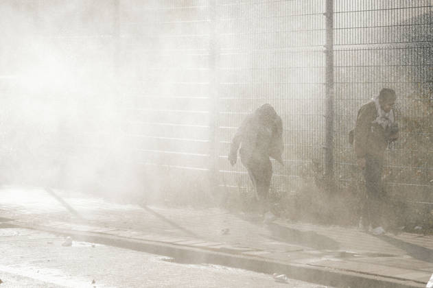 Brussels Belgium Protest People walk past a fenced area amid gas smoke during a protest in Brussels, Belgium on October 12, 2026. Protesters and trade union members stage demonstrations and clash with police during a nationwide public-sector strike against government austerity measures, budget cuts, and reform plans in Brussels, Belgium. Brussels Brussels Capital Belgium Copyright: xSanadxLatifax