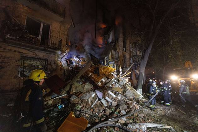 October 12, 2026, Kharkiv, Ukraine: KHARKIV, UKRAINE, OCTOBER 12, 2026: Emergency workers conduct rescue operations at a residential building damaged in a Russian strike in Kharkiv s Kholodnohirskyi district. A firefighter was injured by falling concrete debris while clearing the rubble and was evacuated on a stretcher. Kharkiv Ukraine - ZUMAq101 20261012_zna_q101_139 Copyright: xAndrewxClingx