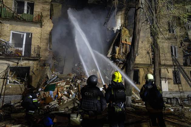 October 13, 2026, Kharkiv, Ukraine: KHARKIV, UKRAINE, OCTOBER 12, 2026: Emergency workers conduct rescue operations at a residential building damaged in a Russian strike in Kharkiv s Kholodnohirskyi district. A firefighter was injured by falling concrete debris while clearing the rubble and was evacuated on a stretcher. Kharkiv Ukraine  - ZUMAq101 20261013_zna_q101_002 Copyright: xAndrewxClingx