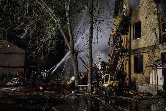 October 13, 2026, Kharkiv, Ukraine: KHARKIV, UKRAINE, OCTOBER 12, 2026: Emergency workers conduct rescue operations at a residential building damaged in a Russian strike in Kharkiv s Kholodnohirskyi district. A firefighter was injured by falling concrete debris while clearing the rubble and was evacuated on a stretcher. Kharkiv Ukraine - ZUMAq101 20261013_zna_q101_003 Copyright: xAndrewxClingx