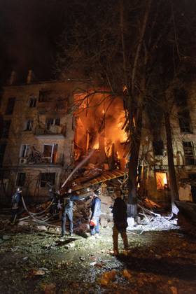 October 12, 2026, Kharkiv, Ukraine: KHARKIV, UKRAINE, OCTOBER 12, 2026: Emergency workers conduct rescue operations at a residential building damaged in a Russian strike in Kharkiv s Kholodnohirskyi district. A firefighter was injured by falling concrete debris while clearing the rubble and was evacuated on a stretcher. Kharkiv Ukraine - ZUMAq101 20261012_zna_q101_144 Copyright: xAndrewxClingx