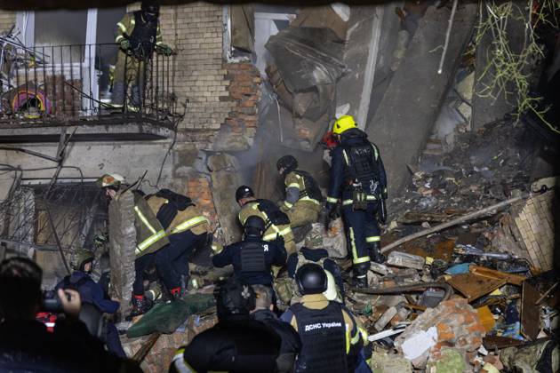 Rescue Operations After Kharkiv Strike KHARKIV, UKRAINE, OCTOBER 12, 2026: Emergency workers conduct rescue operations at a residential building damaged in a Russian strike in Kharkiv s Kholodnohirskyi district. A firefighter was injured by falling concrete debris while clearing the rubble and was evacuated on a stretcher. Kharkiv Ukraine Copyright: x xAndrewxClingx xJNAxPressx