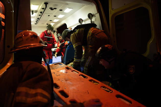 October 12, 2026, Kharkiv, Kharkiv Oblast, Ukraine: Rescuers load an injured firefighter into an ambulance after a sustained injury clearing debris at a Russian cruise missile strike on a residential area in Kharkiv, Ukraine, 2026. Kharkiv Ukraine  - ZUMAm350 20261012_zip_m350_003 Copyright: xCameronxJones-Manleyx