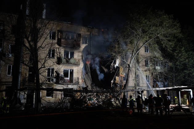 October 12, 2026, Kharkiv, Kharkiv Oblast, Ukraine: Local rescue workers and volunteers clear rubble following a Russian Missile attack on a residential area that killed multiple people in Kharkiv, Ukraine. Emergency crews search through the heavily damaged building and collapsed sections of the building for survivors and the remains of those killed in the attack. Kharkiv Ukraine  - ZUMAm350 20261012_zip_m350_009 Copyright: xCameronxJones-Manleyx