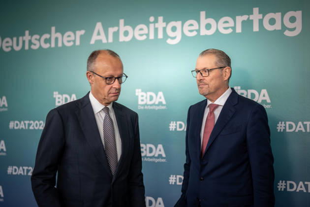 Chancellor Friedrich Merz is welcomed by Rainer Dulger, President of the Confederation of German Employers Associations (BDA), at the start of the 2026 German Employers Day, hosted by the Confederation of German Employers Associations (BDA), Berlin, Germany, at the Berlin Congress Center (bcc)