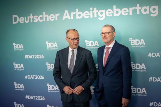 Chancellor Friedrich Merz is welcomed by Rainer Dulger, President of the Confederation of German Employers Associations (BDA), at the start of the 2026 German Employers Day, hosted by the Confederation of German Employers Associations (BDA), Berlin, Germany, at the Berlin Congress Center (bcc)