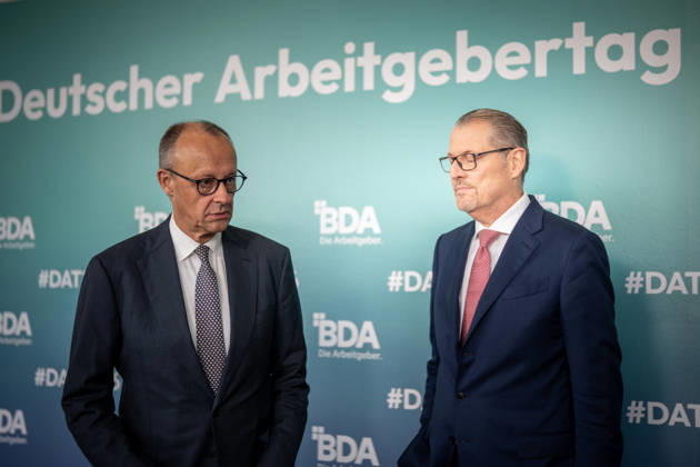 Chancellor Friedrich Merz is welcomed by Rainer Dulger, President of the Confederation of German Employers Associations (BDA), at the start of the 2026 German Employers Day, hosted by the Confederation of German Employers Associations (BDA), Berlin, Germany, at the Berlin Congress Center (bcc)