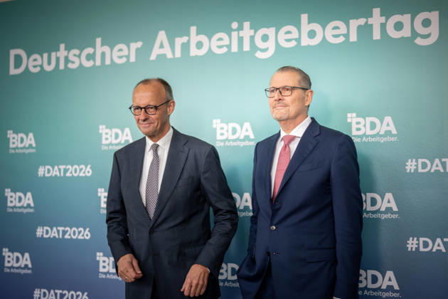 Chancellor Friedrich Merz is welcomed by Rainer Dulger, President of the Confederation of German Employers Associations (BDA), at the start of the 2026 German Employers Day, hosted by the Confederation of German Employers Associations (BDA), Berlin, Germany, at the Berlin Congress Center (bcc)