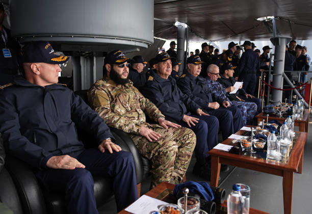NUSRET-2026 Invitational Exercise continues in Turkiye s Izmir IZMIR, TURKIYE - OCTOBER 13: Turkish Naval Forces Commander Admiral Ercument Tatlioglu (3rd L), Syrian Naval Forces Commander Brigadier General Mohammed al-Saud (2nd L) and other participants observe activities aboard TCG Salihreis, the flagship of the NUSRET-2026 Invitation Exercise, during Distinguished Observer Day activities off the coast of Foca, Izmir, Turkiye, on October 13, 2026. Hosted by Turkiye and conducted by the Turkish Naval Forces Mine Fleet Command, the exercise involves naval and air assets from NATO and Turkiye, as well as the Turkish Coast Guard, with observers from various countries. Mahmut Serdar Alakus Anadolu Izmir Turkey. Editorial use only. Please ge Copyright: x2026xAnadoluxMahmutxSerdarxAlakusx