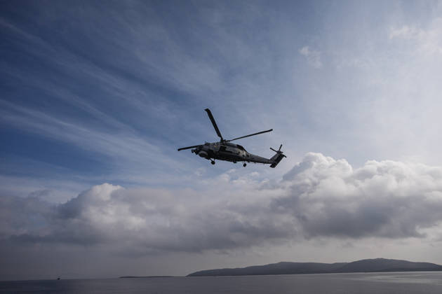 NUSRET-2026 Invitational Exercise continues in Turkiye s Izmir IZMIR, TURKIYE - OCTOBER 13: A military helicopter flies during Distinguished Observer Day activities held off the coast of Foca district in Izmir, Turkiye, on October 13, 2026, as part of the NUSRET-2026 Invitational Exercise. Hosted by Turkiye and conducted by the Turkish Naval Forces Mine Fleet Command, the exercise continues in the Gulf of Izmir and off Karadeniz Eregli, with the participation of naval, air and coast guard assets from NATO and Turkiye, along with observers from various countries. Mahmut Serdar Alakus Anadolu Izmir Turkey. Editorial use only. Please get in touch for any other usage.  Copyright: x2026xAnadoluxMahmutxSerdarxAlakusx