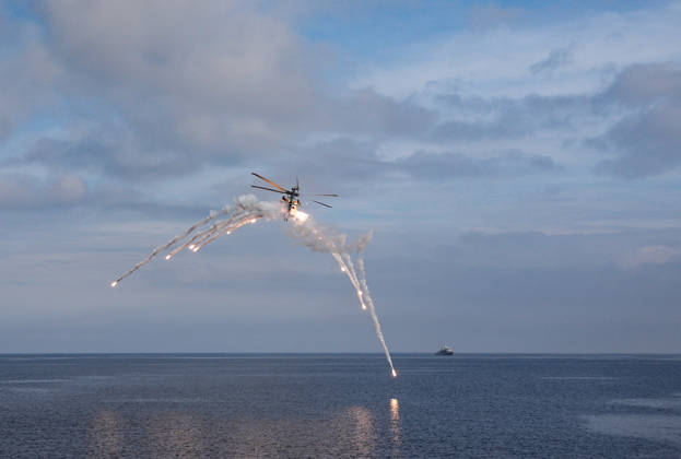NUSRET-2026 Invitational Exercise continues in Turkiye s Izmir IZMIR, TURKIYE - OCTOBER 13: A military helicopter releases flares while flying during Distinguished Observer Day activities held off the coast of Foca district in Izmir, Turkiye, on October 13, 2026, as part of the NUSRET-2026 Invitation Exercise. Hosted by Turkiye and conducted by the Turkish Naval Forces Mine Fleet Command, the exercise continues in the Gulf of Izmir and off Karadeniz Eregli, with the participation of naval, air and coast guard assets from NATO and Turkiye, along with observers from various countries. Mahmut Serdar Alakus Anadolu Izmir Turkey. Editorial use only. Please get in touch for any other usage.  Copyright: x2026xAnadoluxMahmutxSerdarxAlakusx