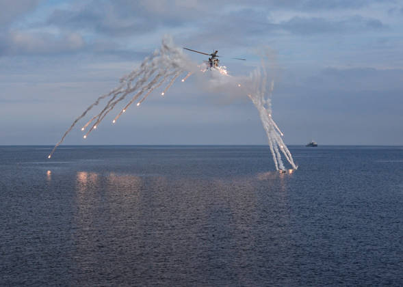 NUSRET-2026 Invitational Exercise continues in Turkiye s Izmir IZMIR, TURKIYE - OCTOBER 13: A military helicopter releases flares while flying during Distinguished Observer Day activities held off the coast of Foca district in Izmir, Turkiye, on October 13, 2026, as part of the NUSRET-2026 Invitation Exercise. Hosted by Turkiye and conducted by the Turkish Naval Forces Mine Fleet Command, the exercise continues in the Gulf of Izmir and off Karadeniz Eregli, with the participation of naval, air and coast guard assets from NATO and Turkiye, along with observers from various countries. Mahmut Serdar Alakus Anadolu Izmir Turkey. Editorial use only. Please get in touch for any other usage.  Copyright: x2026xAnadoluxMahmutxSerdarxAlakusx