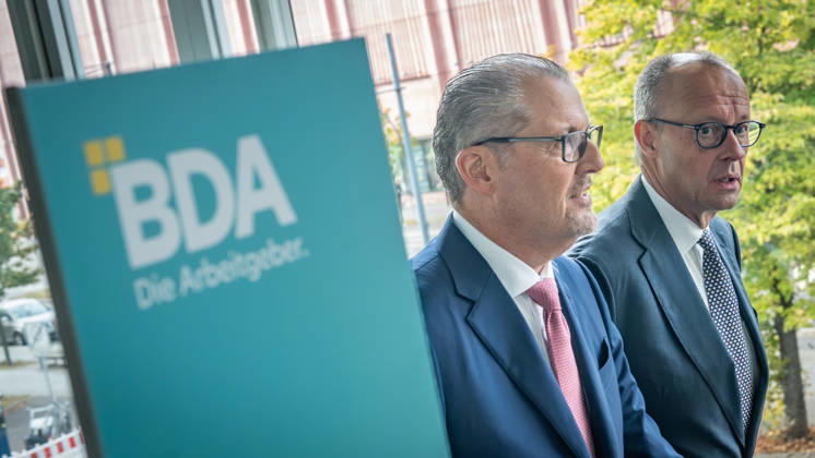 Chancellor Friedrich Merz is welcomed by Rainer Dulger, President of the Confederation of German Employers Associations (BDA), at the start of the 2026 German Employers Day, hosted by the Confederation of German Employers Associations (BDA), Berlin, Germany, at the Berlin Congress Center (bcc)