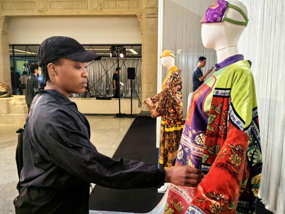 SHANGHAI, CHINA - OCTOBER 13: Visitors view contemporary clothing designs featuring traditional Miao embroidery and other Guizhou intangible cultural heritage patterns during the Shanghai Fashion Week Oriental New Chinese Style autumn series event on October 13, 2026 in Shanghai, China. The event, themed Living Heritage, is held at the Shanghai History Museum and features an immersive exhibition alongside fashion showcases highlighting the modern transformation of traditional crafts by domestic designers.  Copyright: xVCGx 111674007421