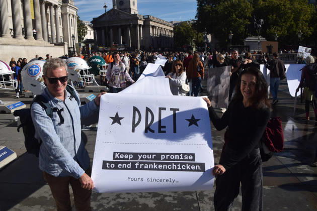 October 13, 2026, London, England, United Kingdom: Protesters pass through Trafalgar Square with a long pledge to boycott Pret signed by 100,000 people during the march to Pret headquarters urging the fast food chain to drop Frankenchickens. Frankenchickens are chickens mostly raised on factory farms who are bred to grow much faster and who are said to suffer far more than regular chickens. London United Kingdom  - ZUMAv130 20261013_zip_v130_026 Copyright: xVukxValcicx