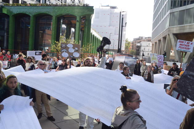 October 13, 2026, London, England, United Kingdom: Protesters gather outside Pret headquarters with a long pledge to boycott Pret signed by 100,000 people urging the fast food chain to drop Frankenchickens. Frankenchickens are chickens mostly raised on factory farms who are bred to grow much faster and who are said to suffer far more than regular chickens. London United Kingdom  - ZUMAv130 20261013_zip_v130_042 Copyright: xVukxValcicx