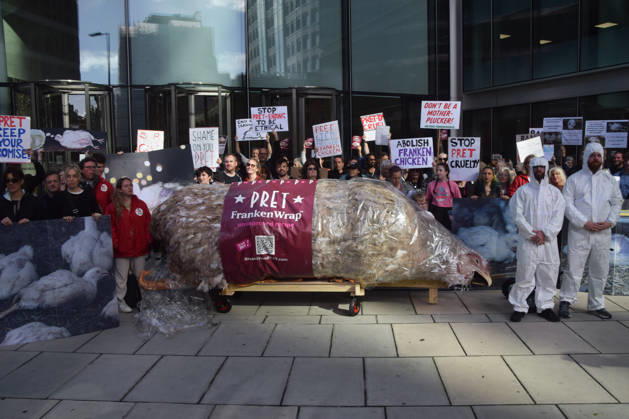 October 13, 2026, London, England, United Kingdom: Protesters gather with a giant wrapped chicken outside Pret headquarters during a protest urging the fast food chain to drop Frankenchickens. Frankenchickens are chickens mostly raised on factory farms who are bred to grow much faster and who are said to suffer far more than regular chickens. London United Kingdom  - ZUMAv130 20261013_zip_v130_045 Copyright: xVukxValcicx