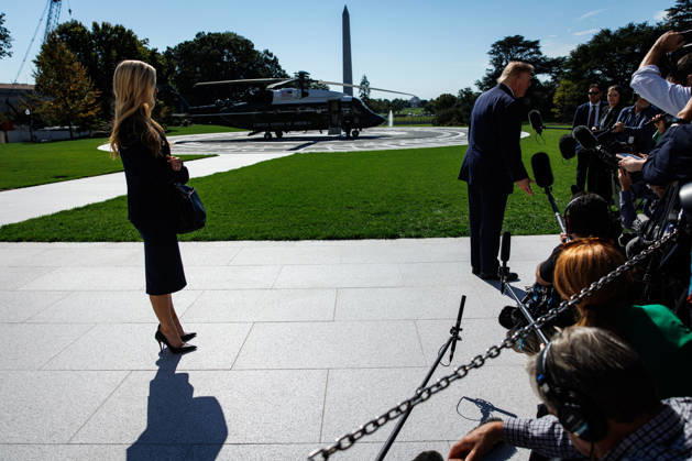 DC: President Trump Departs the White House White House Press Secretary Katie Zacharia listens as President Donald Trump speaks to members of the media before departing from the South Lawn of the White House in Marine One on October 13, 2026 in Washington, D.C. Trump is heading to Wasilla, Alaska for a midterm campaign rally in support of Senator Dan Sullivan and Representative Nick Begich before heading to Las Vegas, Nevada where he will spend the night. (Photo by Samuel Corum Pool ABACAPRESS.COM) Washington DC United States  Copyright: xPool ABACAx