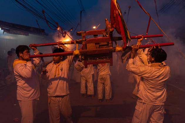October 13, 2026, Trang, Thailand: Devotees set off firecrackers during a street procession in the Vegetarian Festival..The annual Vegetarian Festival is held in Bangkok and many parts of southern Thailand, including Trang, Phatthalung, and Phuket, where worshippers refrain from eating animal products over the nine days, coinciding with the celebration of the Nine Emperor Gods. Trang Thailand - ZUMAs197 20261013_aaa_s197_160 Copyright: xPeeraponxBoonyakiatx