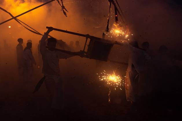 October 13, 2026, Trang, Thailand: Devotees set off firecrackers during a street procession in the Vegetarian Festival..The annual Vegetarian Festival is held in Bangkok and many parts of southern Thailand, including Trang, Phatthalung, and Phuket, where worshippers refrain from eating animal products over the nine days, coinciding with the celebration of the Nine Emperor Gods. Trang Thailand  - ZUMAs197 20261013_aaa_s197_167 Copyright: xPeeraponxBoonyakiatx