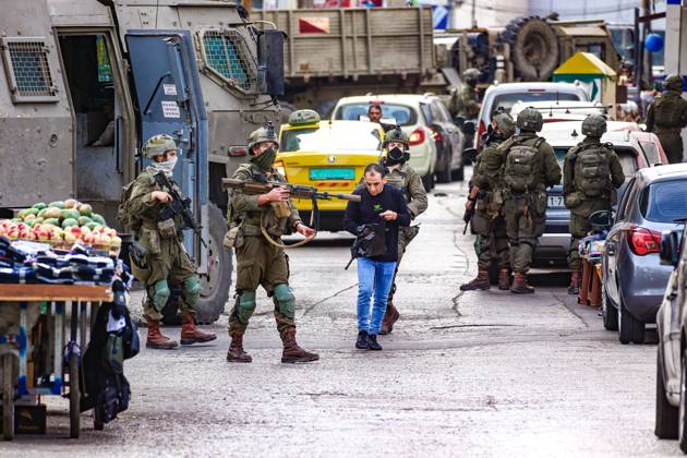 October 13, 2026, Ramallah, Palestine, State of: RAMALLAH, WEST BANK, PALESTINE, OCTOBER 13, 2026: Israeli forces conduct a raid in Ramallah in the occupied West Bank. The operation includes a raid on the offices of Addameer Prisoner Support and Human Rights Association. The Palestinian Ministry of Health reported two people wounded, including a 14-year-old boy wounded by Israeli gunfire, while several others were treated for tear gas inhalation. Ramallah Palestine, State of - ZUMAq101 20261013_zna_q101_186 Copyright: xSalmanxMohsenxAlkhatibx