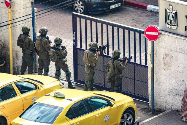 October 13, 2026, Ramallah, Palestine, State of: RAMALLAH, WEST BANK, PALESTINE, OCTOBER 13, 2026: Israeli forces conduct a raid in Ramallah in the occupied West Bank. The operation includes a raid on the offices of Addameer Prisoner Support and Human Rights Association. The Palestinian Ministry of Health reported two people wounded, including a 14-year-old boy wounded by Israeli gunfire, while several others were treated for tear gas inhalation. Ramallah Palestine, State of - ZUMAq101 20261013_zna_q101_193 Copyright: xSalmanxMohsenxAlkhatibx