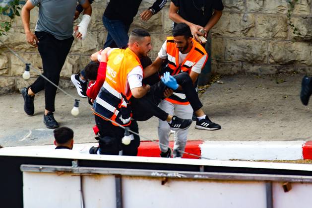 October 13, 2026, Ramallah, Palestine, State of: RAMALLAH, WEST BANK, PALESTINE, OCTOBER 13, 2026: Israeli forces conduct a raid in Ramallah in the occupied West Bank. The operation includes a raid on the offices of Addameer Prisoner Support and Human Rights Association. The Palestinian Ministry of Health reported two people wounded, including a 14-year-old boy wounded by Israeli gunfire, while several others were treated for tear gas inhalation. Ramallah Palestine, State of - ZUMAq101 20261013_zna_q101_198 Copyright: xSalmanxMohsenxAlkhatibx