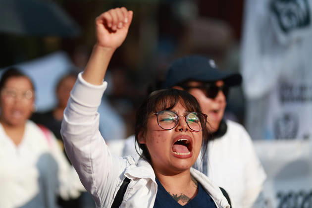 Thousands of healthcare workers hold national protest in Mexico City MEXICO CITY, MEXICO - OCTOBER 13: A woman takes part in a national protest march demanding wage increases for healthcare workers and more medical supplies for Mexico s public health system, in Mexico City, Mexico on October 13, 2026. Thousands of members of the Mexican Social Security Institute (IMSS) marched to demand higher wages, improved working conditions, and action to address nationwide shortages of basic medicines and supplies across public hospitals. Daniel Cardenas Anadolu Mexico City Mexico. Editorial use only. Please get in touch for any other usage.  Copyright: x2026xAnadoluxDanielxCardenasx