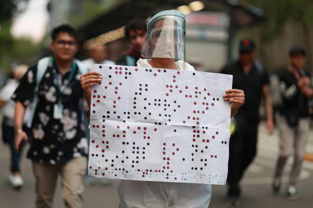 Thousands of healthcare workers hold national protest in Mexico City MEXICO CITY, MEXICO - OCTOBER 13: A woman takes part in a national protest march demanding wage increases for healthcare workers and more medical supplies for Mexico s public health system, in Mexico City, Mexico on October 13, 2026. Thousands of members of the Mexican Social Security Institute (IMSS) marched to demand higher wages, improved working conditions, and action to address nationwide shortages of basic medicines and supplies across public hospitals. Daniel Cardenas Anadolu Mexico City Mexico. Editorial use only. Please get in touch for any other usage.  Copyright: x2026xAnadoluxDanielxCardenasx