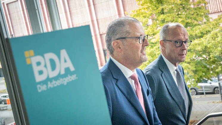Chancellor Friedrich Merz is welcomed by Rainer Dulger, President of the Confederation of German Employers Associations (BDA), at the start of the 2026 German Employers Day, hosted by the Confederation of German Employers Associations (BDA), Berlin, Germany, at the Berlin Congress Center (bcc)