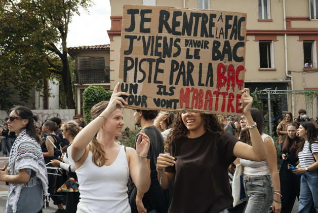 High School Student Mobilisation - Toulouse Two protesters holding a placard reading - I m off to uni, I’ve just passed my A-levels, being tracked by the police – one day they’ll shoot me down. Act V of the secondary school and university students protests. Young people and the world of work are continuing their joint mobilisation and demands for adequate resources for education, better study conditions, an end to student precariousness, and access to housing. France, Toulouse, 13 October 2026. Photo by Patricia Huchot-Boissier AbacaPress.com. TOULOUSE OCCITANIE France  Copyright: xHuchot-BoissierxPatricia ABACAx