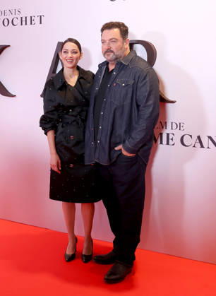 Avant-première du film Karma au cinema Pathé Palace, Paris Marion Cotillard et Denis Menochet Avant premiere du Film Karma de Guillaume Canet au cinema Pathé Palace. France , Paris le 13 octobre 2026  Copyright: xDidierxFereyx