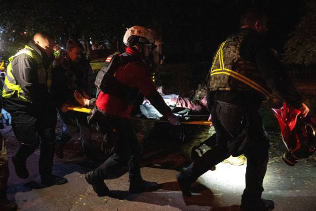 Ballistic missile strikes next to nine-story residential building in Desnianskyi district of Kyiv Rescuers carry an injured person on a stretcher after a Russian missile strike on a nine-story residential building in the Desnianskyi district of Kyiv, Ukraine, on October 14, 2026. Russia launched a massive ballistic missile attack on the capital. Three women were killed and 19 people were injured in the Desnianskyi district, including a seven-year-old girl. Apartments on the first through eighth floors of the building were also damaged, Credit:Danylo Antoniuk Ukrinform Avalon Ukraine, Kyiv  Copyright: xDanyloxAntoniukx xUkrinformx xAvalonx 1143212146