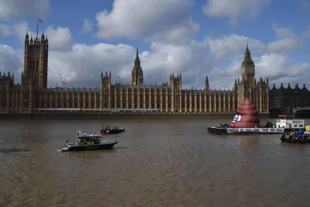 October 14, 2026, London, England, United Kingdom: Campaigners inflate a giant ˜poo™ on the River Thames outside the Parliament, calling on the UK government to act on sewage pollution. London United Kingdom - ZUMAv130 20261014_zip_v130_003 Copyright: xVukxValcicx