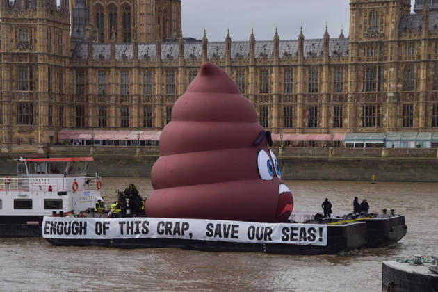 October 14, 2026, London, England, United Kingdom: Campaigners inflate a giant ˜poo™ on the River Thames outside the Parliament, calling on the UK government to act on sewage pollution. London United Kingdom - ZUMAv130 20261014_zip_v130_009 Copyright: xVukxValcicx
