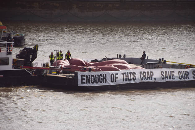 October 14, 2026, London, England, United Kingdom: Campaigners prepare to inflate a giant ˜poo™ on the River Thames outside the Parliament, calling on the UK government to act on sewage pollution. London United Kingdom - ZUMAv130 20261014_zip_v130_017 Copyright: xVukxValcicx