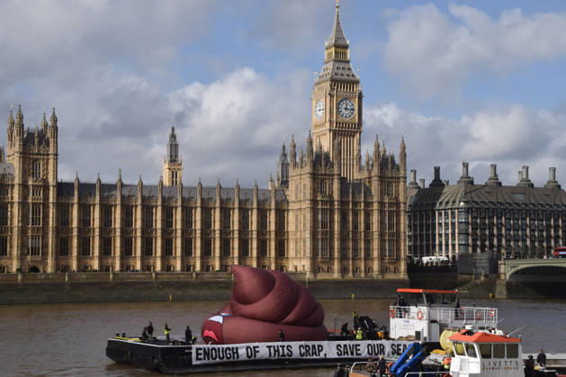 October 14, 2026, London, England, United Kingdom: Campaigners inflate a giant ˜poo™ on the River Thames outside the Parliament, calling on the UK government to act on sewage pollution. London United Kingdom - ZUMAv130 20261014_zip_v130_021 Copyright: xVukxValcicx