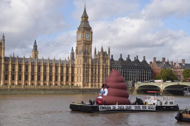 October 14, 2026, London, England, United Kingdom: Campaigners inflate a giant ˜poo™ on the River Thames outside the Parliament, calling on the UK government to act on sewage pollution. London United Kingdom - ZUMAv130 20261014_zip_v130_026 Copyright: xVukxValcicx