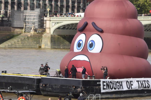 October 14, 2026, London, England, United Kingdom: Actor and campaigner DANNY DYER stands next to an inflatable giant ˜poo™ on the River Thames outside the Parliament during a protest calling on the UK government to act on sewage pollution. London United Kingdom - ZUMAv130 20261014_zip_v130_054 Copyright: xVukxValcicx