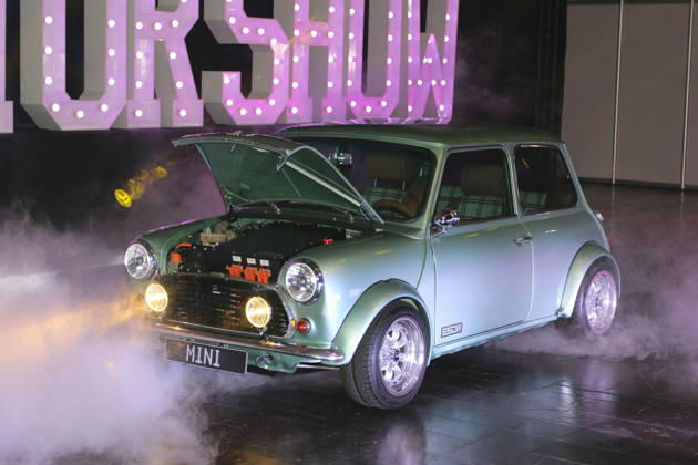 Rover Mini WATTson electric car with a Tesla motor, based on a 1996 Rover Mini Cooper 1 3i, in artificial fog with the hood open, Media event Carwalk for the Essen Motor Show on October 14, 2026, at Messe Essen in the run-up to the Essen Motor Show 2026 (November 28, 2026 – December 6, 2026), EMS Preview on November 27, 2026, special exhibition tuningXperience